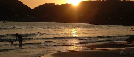 On the beach, sun-loungers