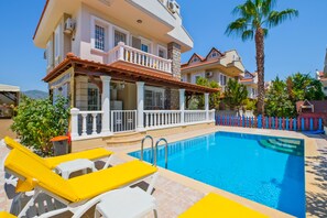 Seasonal outdoor pool, pool umbrellas, pool loungers