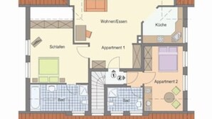 Plano de planta de un edificio con dos apartamentos, cocina, baño, sala de estar y balcón.