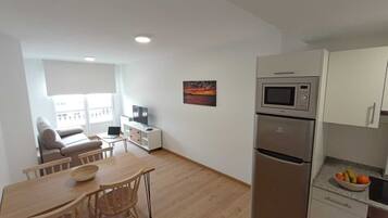 Apartment, 1 Bedroom | Living area | TV