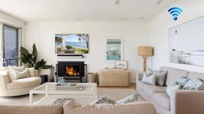 Smart TV, fireplace - Paradiso Beach House - luxury waterfront property, private retreat, swimming pool, outdoor dining (Salamander Bay)