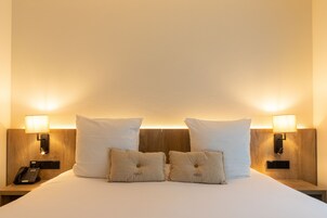 Premium bedding, desk, laptop workspace, free WiFi