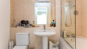 A bathroom with a toilet, sink, and shower. - Huge Penthouse - Birmingham Central - Balcony (Birmingham)