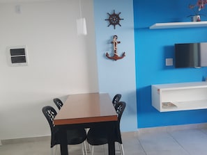 Comfort Apartment | Living area | 32-inch Smart TV with satellite channels, TV