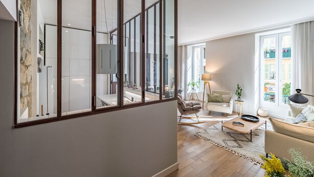 A modern living room with a sofa, coffee table, and a dining area. - NEW-Hyper Centre-Cozy Chic-Renovated apartment with all comforts-AC-Balconnet-asc-Park (Nice)