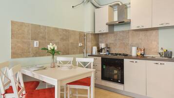 Family Apartment | Private kitchen | Full-sized fridge, microwave, oven, coffee/tea maker