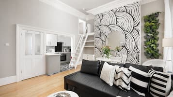 Appartement | Coin séjour | TV connectée de 45 pouces avec chaînes par câble, télévision