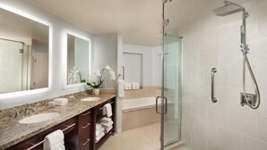 A modern bathroom with two sinks, a glass shower enclosure, and a large mirror. - The Westin Mission Hills Resort Villas, Palm Springs (Rancho Mirage)