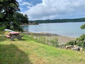 Enjoy a serene lakeside setting with a picnic table for outdoor dining and opportunities for boating and water activities.