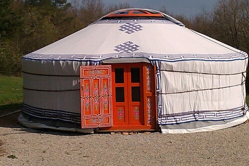 Mongolian yurt, on the edge of a forest and a hiking trail