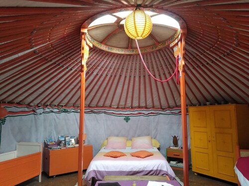 Mongolian yurt, on the edge of a forest and a hiking trail