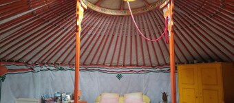 Mongolian yurt, on the edge of a forest and a hiking trail