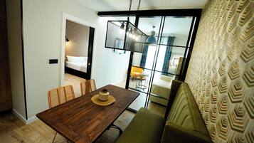 Comfort Apartment, 1 King Bed, Non Smoking, City View | Living area | 50-inch Smart TV with digital channels, TV, Netflix