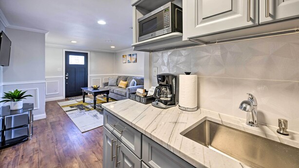 A modern kitchen with a marble countertop, stainless steel appliances, and a built-in sink. - Bay Shore Vacation Rental ~ 7 Mi to the Beach (Bay Shore)