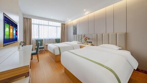 A hotel room with two beds, a desk, a chair, a TV, and a window with curtains. - Greentree Inn Hefei Binhu New District Ziyun Road and Qingtan Road Jianghuai Car Factory (Hefei)