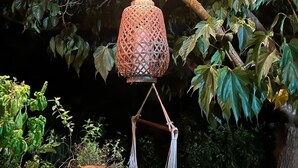 A hanging lantern with a woven design, suspended from a tree branch. - Rental St tropez Gassin luxury bungalow 6pers (Gassin)