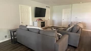 Smart TV, fireplace, foosball, books