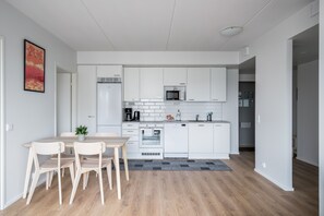Standard Apartment, 2 Bedrooms, Balcony | Private kitchen | Full-size fridge, microwave, oven, stovetop - Hiisi Homes Espoo Finnoo (Espoo)