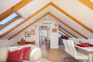 Comfort Loft | Living area | 150-cm Smart TV with cable channels, TV