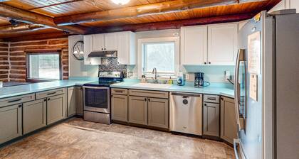 Relaxing dog-friendly water-view cabin with firepit, deck, grill, & full kitchen