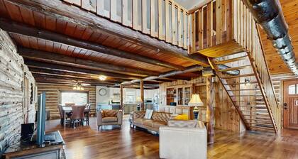 Relaxing dog-friendly water-view cabin with firepit, deck, grill, & full kitchen