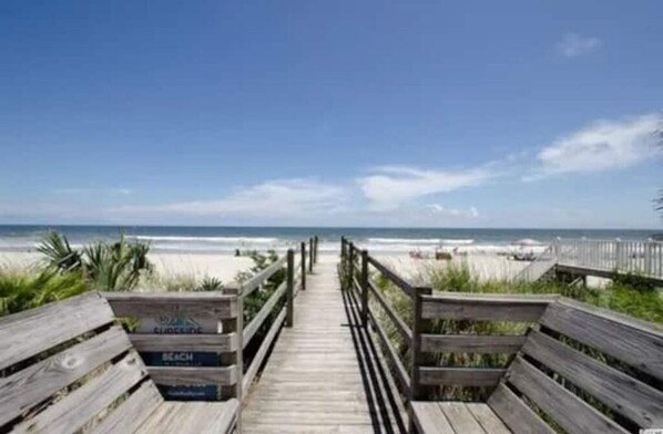 On the beach, sun loungers, beach towels