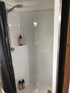 Shower, hair dryer, towels, soap