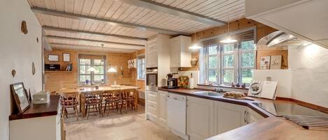 Fridge, stovetop, dishwasher, coffee/tea maker