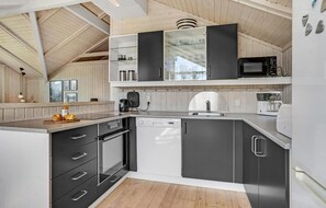 Fridge, stovetop, dishwasher, coffee/tea maker
