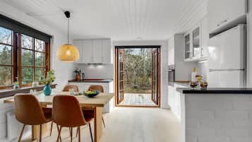 Fridge, stovetop, dishwasher, coffee/tea maker