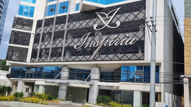 A building with a large sign reading "Inspiria". - Inspiria Condo Units beside Abreeza Mall Davao (Davao)