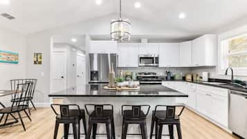 Fridge, coffee/tea maker, highchair, cookware/dishes/utensils