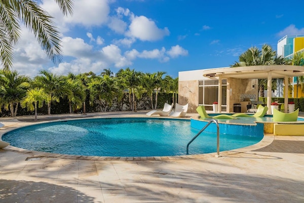 Relax in the pool while admiring the garden view.
