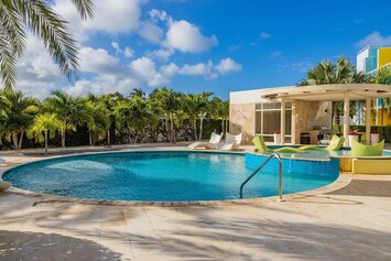 Relax in the pool while admiring the garden view.