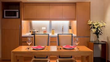 Mini-fridge, microwave, cookware/dishes/utensils