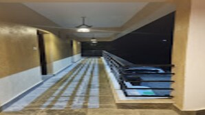 A corridor with a staircase leading to a landing. - MeroStay 025 Atithi Satkar (Mahamanjushree Nagarkot)
