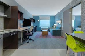 Hypo-allergenic bedding, desk, laptop workspace, blackout drapes