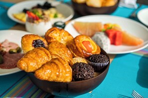 A variety of pastries and desserts on a table. - Angsana Ho Tram (Ho Chi Minh City)