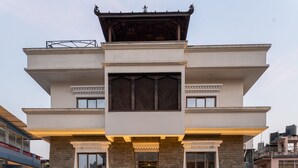 A multi-story hotel with a central atrium, balconies, and a traditional architectural style. - Hotel Lo Mustang (Kathmandu)