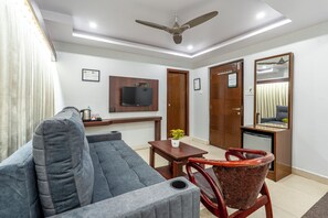 Coffres-forts dans les chambres, bureau, fer et planche à repasser