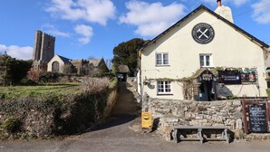 A building with a sign for 'The Carpenters Arms' and 'Guinness Six Nations' beer.