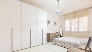 A bedroom with a bed, a dresser, a wardrobe, and a mirror. - 3196 Villa Angela by Barbarhouse (Nardò)