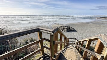 Walk along the boardwalk to the ocean and enjoy the view of the pebbly shore and rocky shoreline.