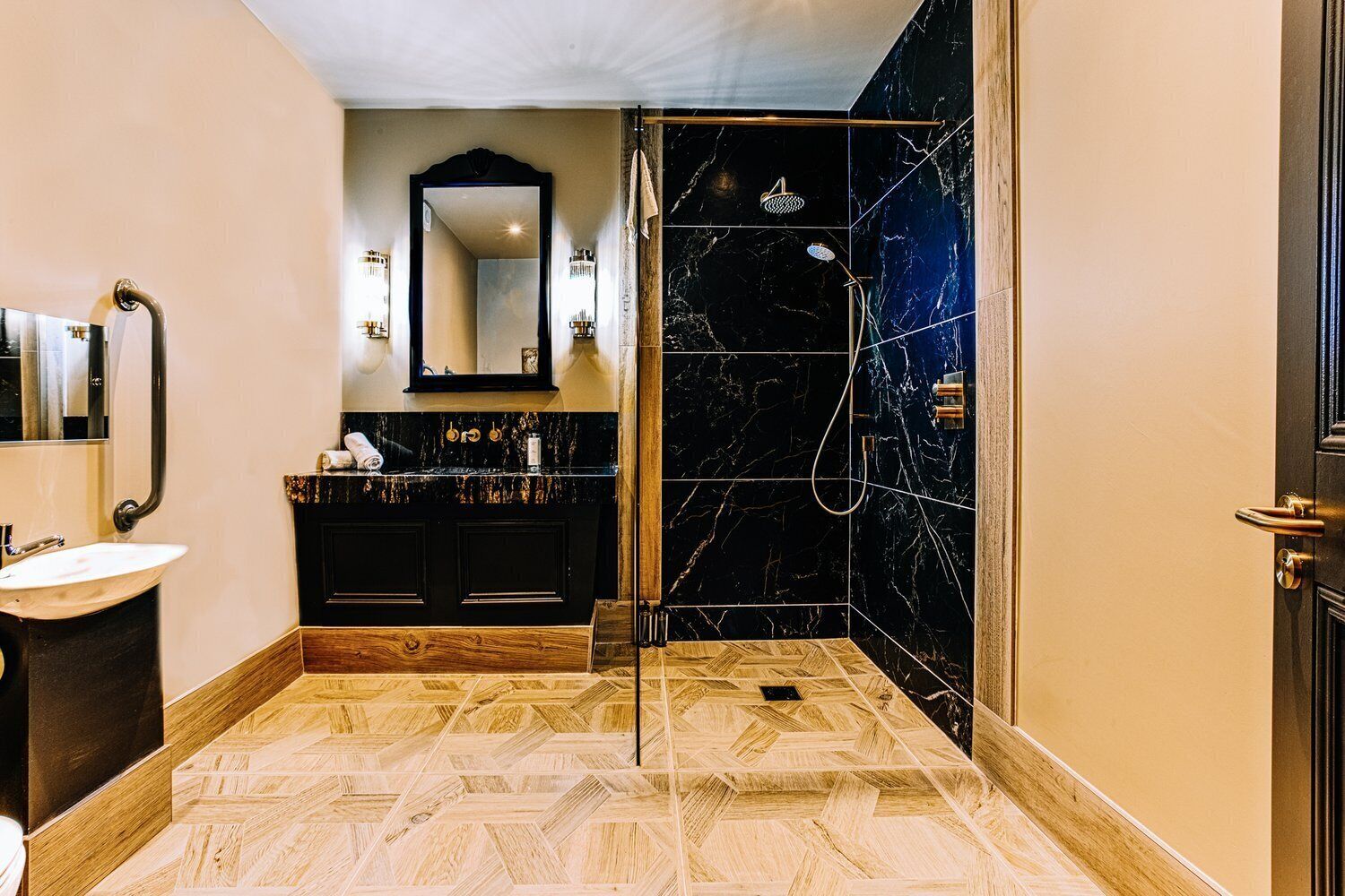 A modern bathroom with a vanity, sink, and mirror.
