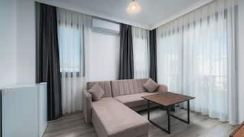 Standard Suite | Living area | 56-inch TV with cable channels