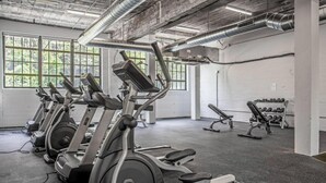 A gym with stationary bikes, treadmills, and dumbbells. - 5104 Cartridge Factory Loft (Maineville)