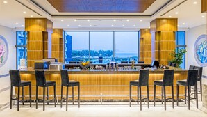 A bar area with a view of the sea, wooden paneling, and bar stools. - My Ella Bodrum Resort & Spa (Bodrum)