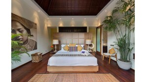 Relax in this serene bedroom with a large bed, nightstand, and a beautiful painting.