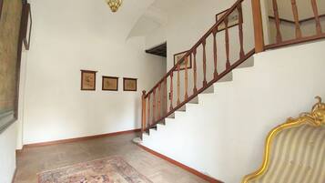 A staircase with wooden railings leading to an upper floor.