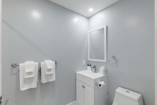 Bathtub, hair dryer, towels
